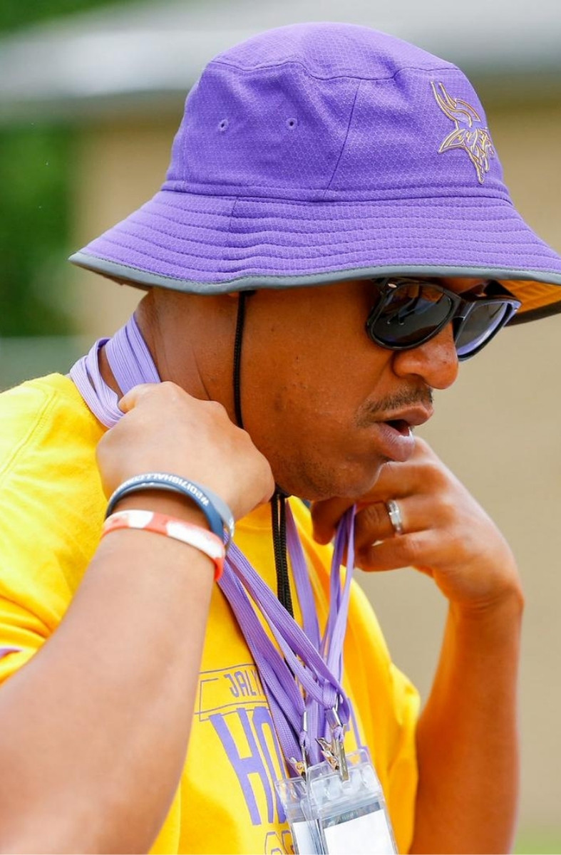 Vaughn in a purple bucket hat at a football camp