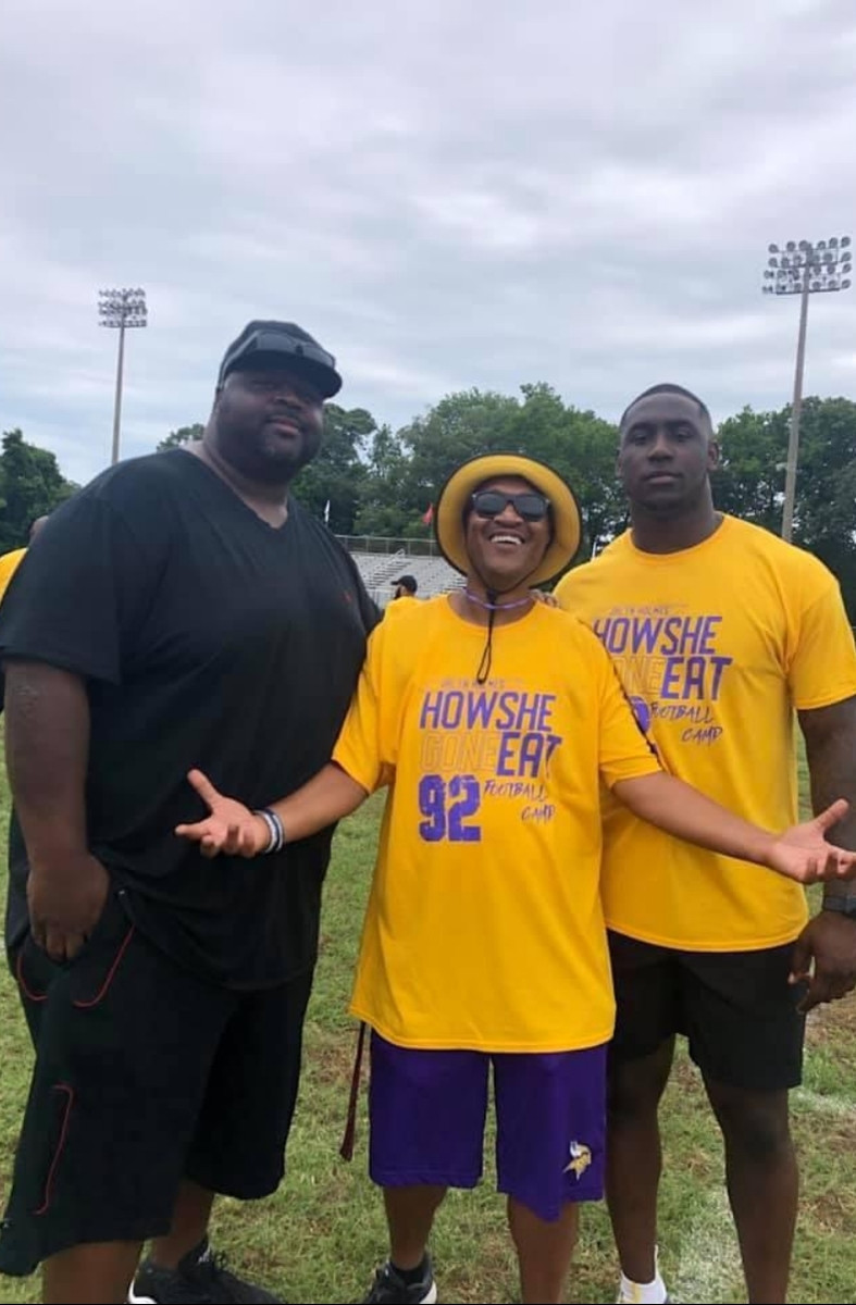 Vaughn with Jalyn and friends at a football field