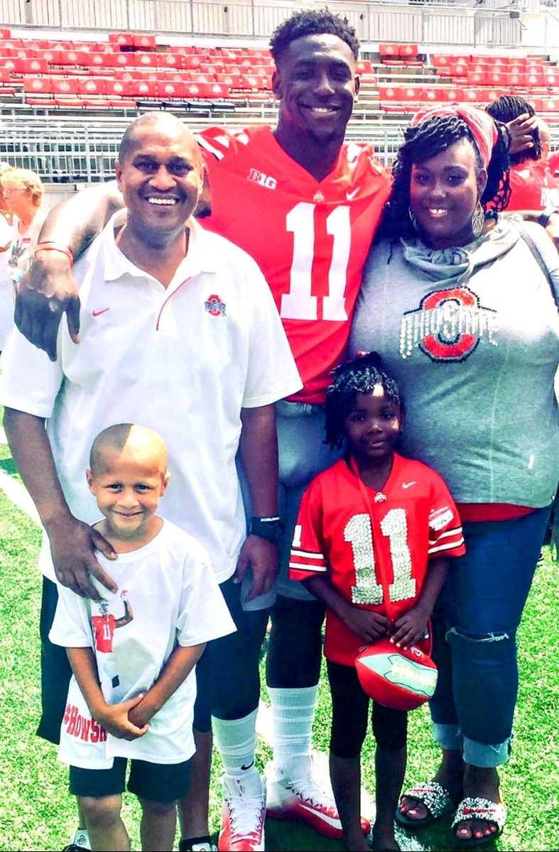 Vaughn with Jalyn and family on the field at Ohio State
